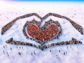 Aerial photo of people making a heart shape and two hands 